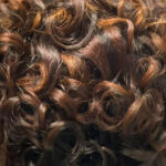 Photograph of Black woman's weave in.